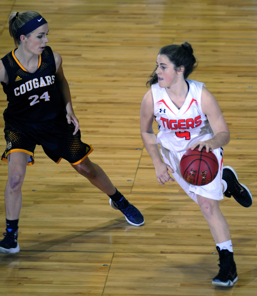 Mt. Blue’s Caitlin Kane, left, guards Gardiner’s Lauren Chadwick during a Class A North quarterfinal game Friday at the Augusta Civic Center.