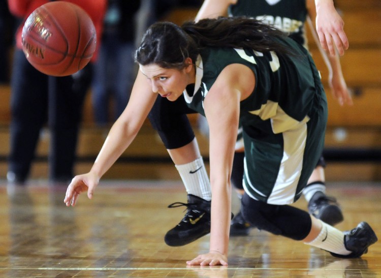 Carrabec’s Mickayla Willette, left, scrambles for a loose ball during a Class C South quarterfinal Monday against Boothbay at the Augusta Civic Center. Boothbay won, 32-17.