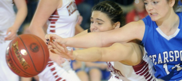 Staff photo by Andy Molloy
Richmond’s Mackenzie Abbott, left, chases the ball with Searsport’s Brooklynn Alberts during a Class C South quarterfinal on Tuesday at the Augusta Civic Center.