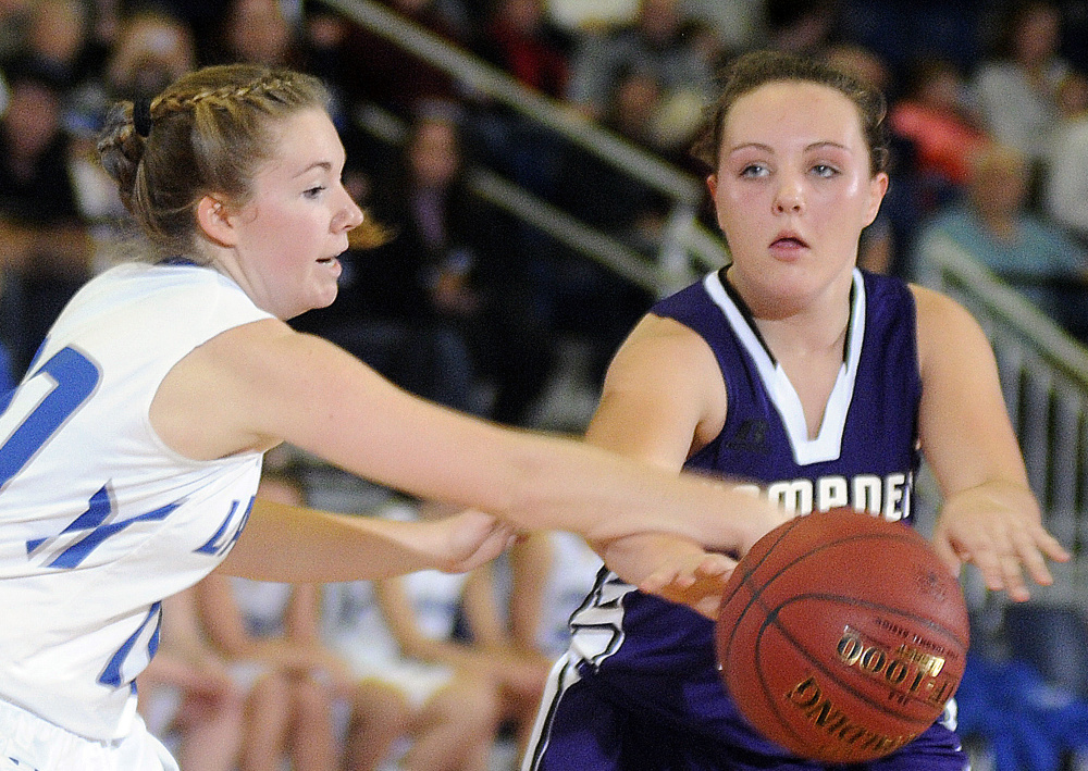 Lawrence’s Camryn Caldwell guards Hampden’s Braylee Wildman during a Class A North semifinal at the Augusta Civic Center.