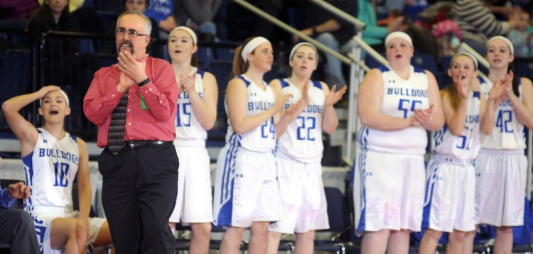 The Madison Area Memorial High School’s team celebrates against Searsport District High School during a Class C South semifinal game Thursday  in Augusta.