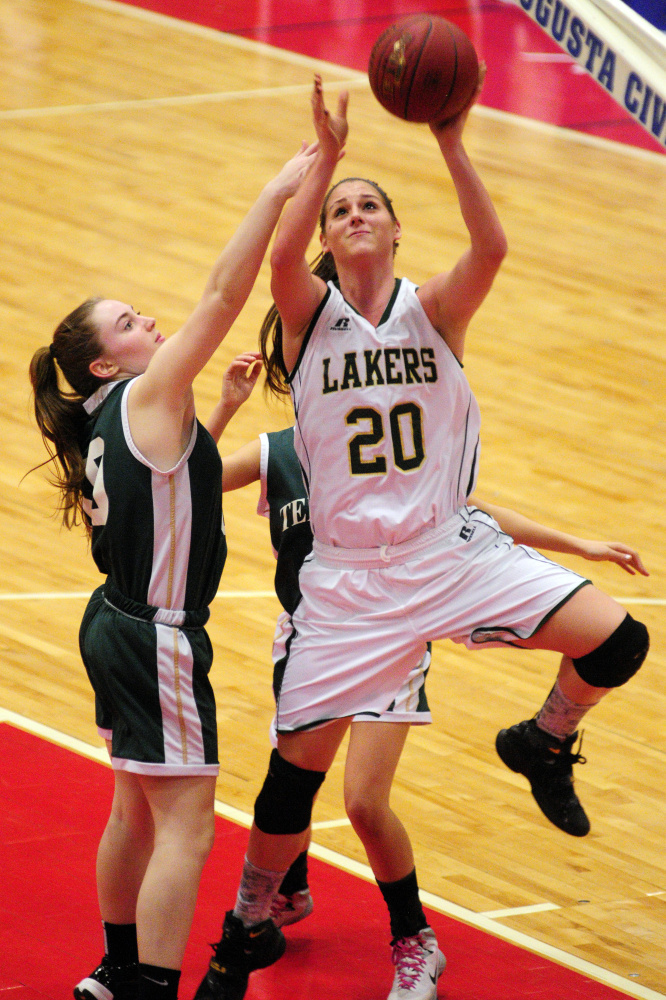 Temple’s Daphne Labbe, left, and Deleyni Carr, right, defend Rangeley’s Blayke Morin during a Class D South semifinal last Thursday at the Augusta Civic Center.