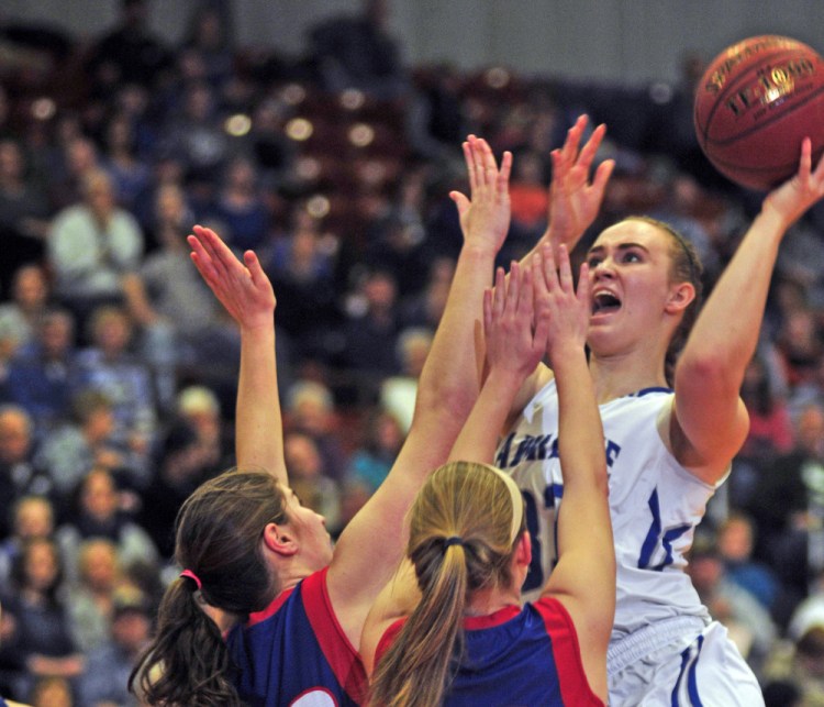 Lawrence senior forward Nia Irving shoots against Messalonskee during the Class A North championship game last Friday in the Augusta Civic Center.