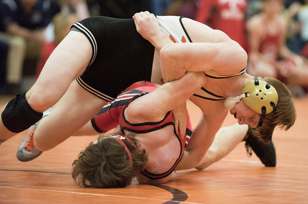 Gardiner’s Peter Del Gallo, top, defeats Cony’s Quinton Arbour during a 126-pound semifinal match at the Tiger Invitational earlier this season. Del Gallo won the 120-pound New England title on Saturday in Providence, Rhode Island.