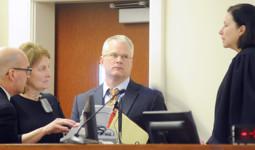 Superior Court Justice Michaela Murphy, right, holds a sidebar conference Monday with prosecution and defense attorneys during the opening arguments of the murder trial of Justin Pillsbury. Pillsbury claims he was defending himself from his girlfriend, Jillian Jones, who died of several stab wounds at their Augusta apartment in November 2013.