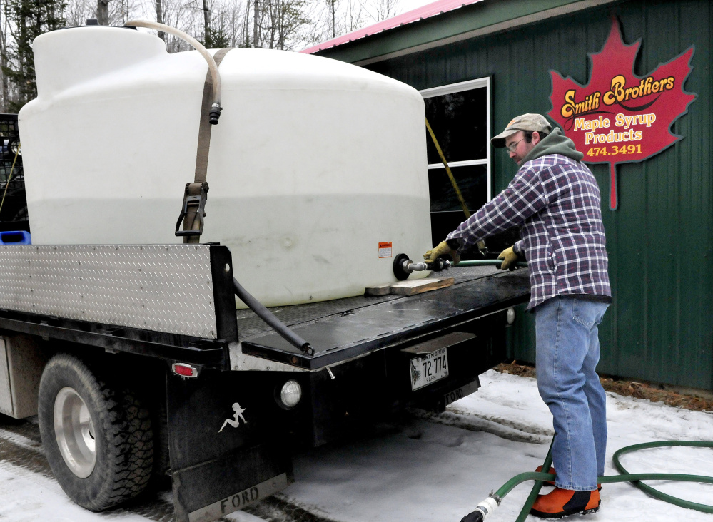 Jim Smith pumps sap into the sap house at the family Smith Brothers maple syrup company in Skowhegan on Thursday. Smith is participating in Skowhegan’s Maple Fest and Maine Maple Sunday this weekend.