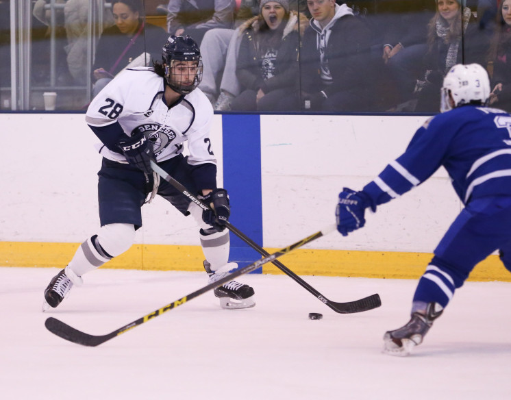 Waterville Senior High graduate Matty Lee skates the puck up ice during a game played earlier this season. Lee, a junior on the SUNY Geneseo hockey team, will take part in the Division III Frozen Four on Friday at 4 p.m. at Herb Brooks Arena in Lake Placid, N.Y. The Knights have played this season in memory of slain teammate Matthew Hutchinson, who was found dead inside a Geneseo home in January, a victim in a violent attack that also took the life of senior Kelsey Annese, a guard on the Geneseo women’s basketball team.