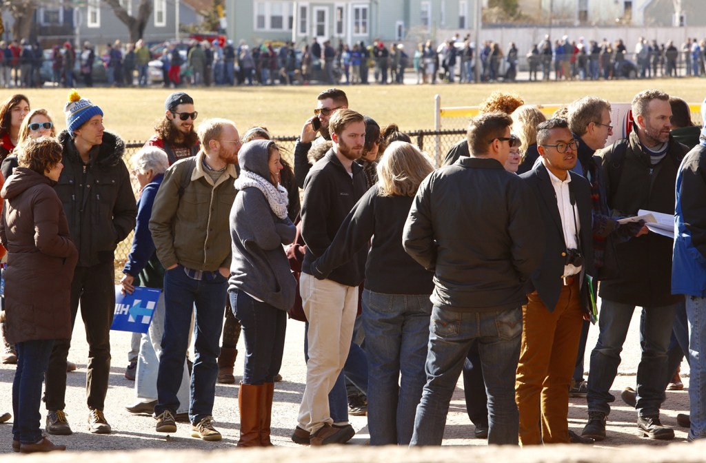 Hundreds of Democratic voters wait in line to caucus at Deering High School in Portland on Sunday. Carl D. Walsh/Staff Photographer