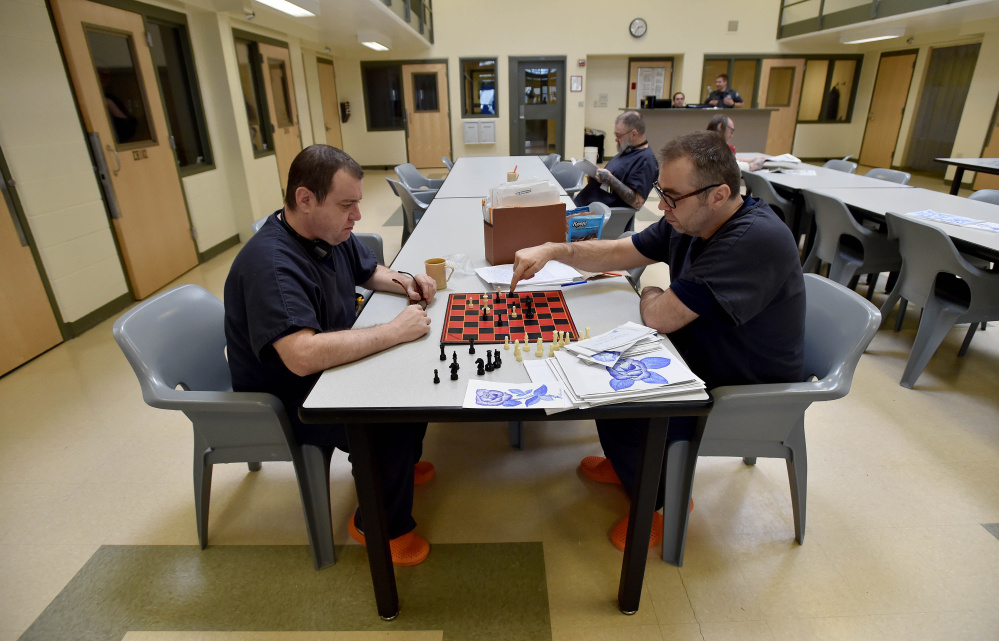 Inmates play a game of chess at the Somerset County Jail in East Madison on Friday. The jail, which boards inmates from other counties that have crowding problems, will benefit from a supplemental jail funding bill passed by the Legislature Friday, when it overrode a Gov. Paul LePage veto.