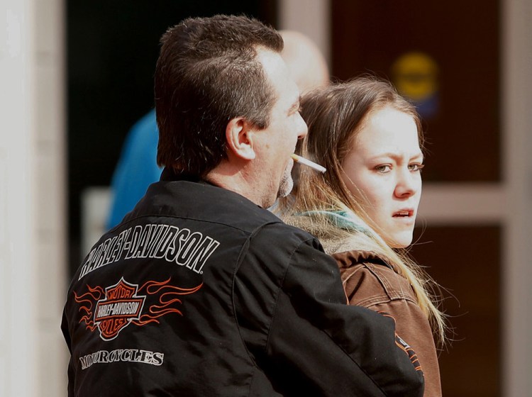 Sarah Vye, 22, of Auburn, leaves court in Lewiston Wednesday after pleading not guilty on charges she abandoned a dog  outside an animal shelter in January. Carl D. Walsh/Staff Photographer