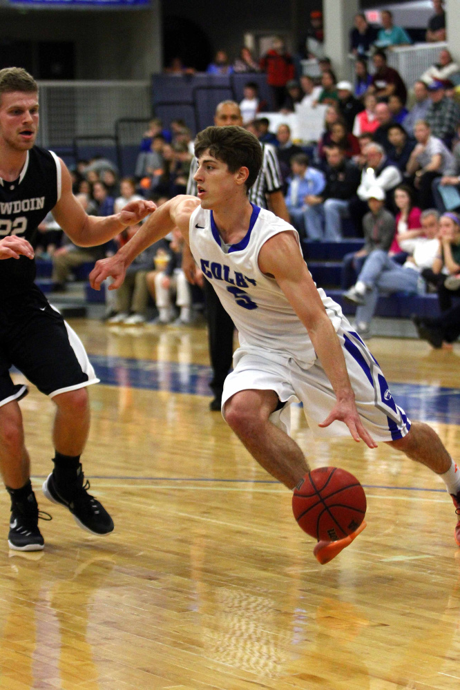 Colby guard Pat Dickert drives to the basket during a game against Bowdoin last season. Dickert became an Internet sensation when he posted a video of himself dunking from behind a foul line.