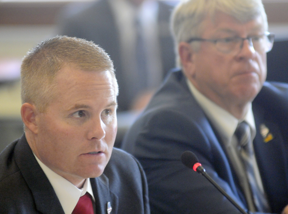 Maine Warden Service Col. Joel Wilkinson, left, and Inland Fisheries and Wildlife Commissioner Chandler Woodcock appear at a legislative hearing in Augusta on  Wednesday. Wilkinson and Woodcock were called by the Inland Fisheries and Wildlife Committee to answer questions in response to a Maine Sunday Telegram story about an undercover game warden operation.