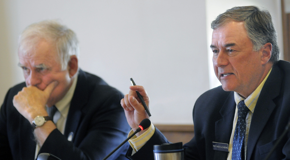 Rep. Robert S. Duchesne, D-Hudson, right, and Senator Paul Davis, R-Sangerville, members of the Inland Fisheries and Wildlife Committee, are seen at a legislative hearing in Augusta on Wednesday over a Maine Sunday Telegram story about an undercover game warden operation.