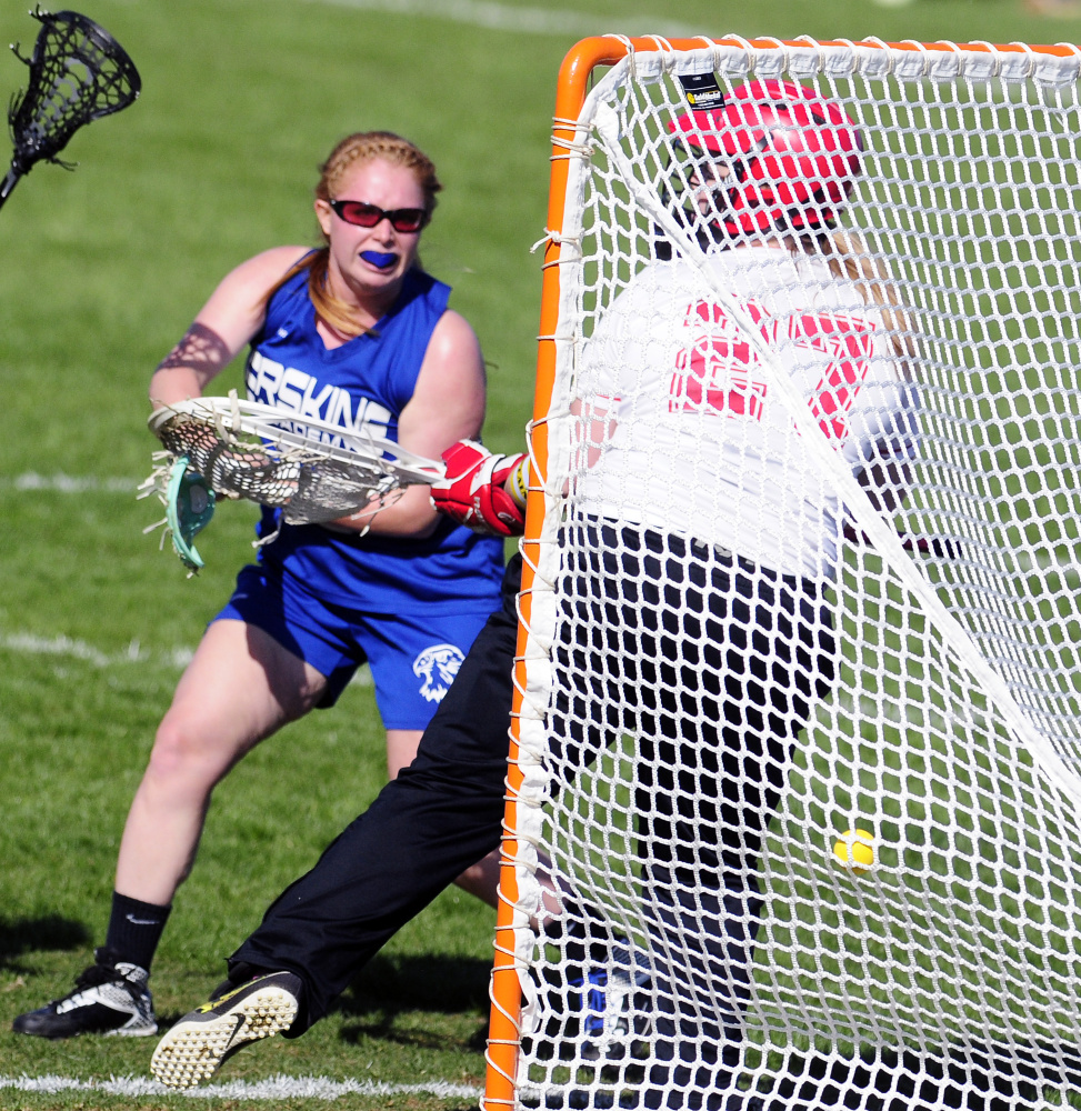 Erskine senior midfielder Kaitlyn Darveau\ shoots and scores on Cony keeper Lizzie Dennison during a Class B North game last month. The Eagles enter the Class B North playoffs as the No. 7 seed.