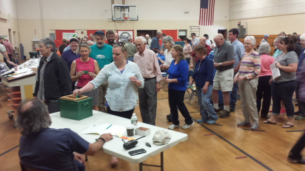 Kingfield residents vote by secret ballot Saturday in the election of municipal officials at Kingfield Elementary School.