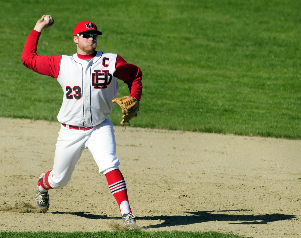 Hall-Dale shortstop Ryan Sinclair throws to first base during a game against Carrabec on April 27. Sinclair was named a finalist for the John Winkin Award, which is given annually to the top senior player in the state.