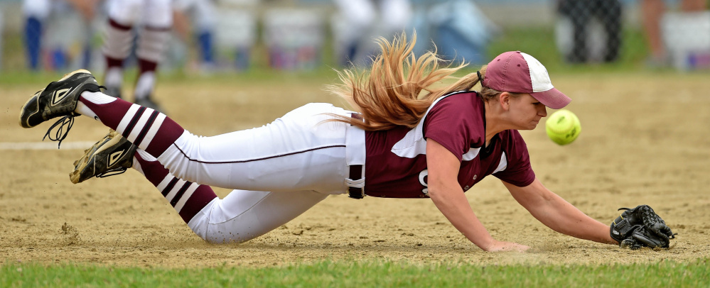 Staff photo by Michael G. Seamans 
 Edward Little's Taylor Depot dives for a ground ball against Messalonskee during a Class A North semifinal game Saturday in Oakland.