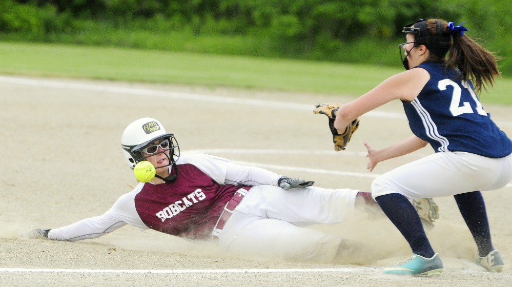 Richmond baserunner Sydney Tilton slides safely into third ahead of the throw to Greenville third baseman Jordan Mann for a two run triple during a Class D South semifinal Friday in Richmond.