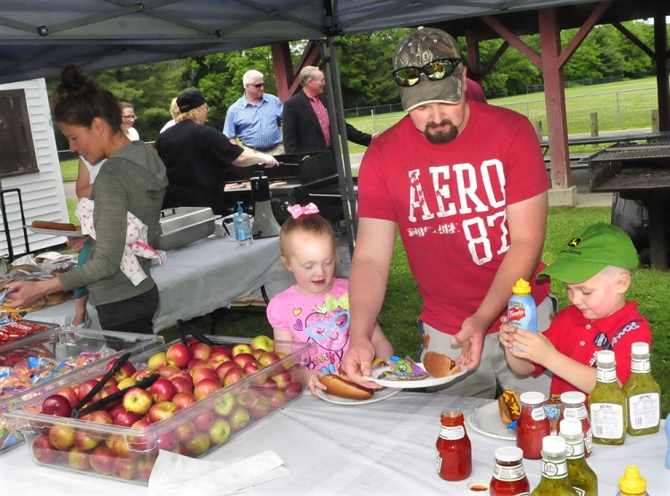 Steven Proctor and his children, Desirae and Dylan, take part in a free lunch last June 2015, during the kickoff of the summer meal program sponsored by AOS 92 and the U.S. Department of Agriculture. This year's program begins Monday and is for children of all income levels. The meals are served in Waterville, Winslow and Vassalboro and are free to anyone under age 18 who wants one.