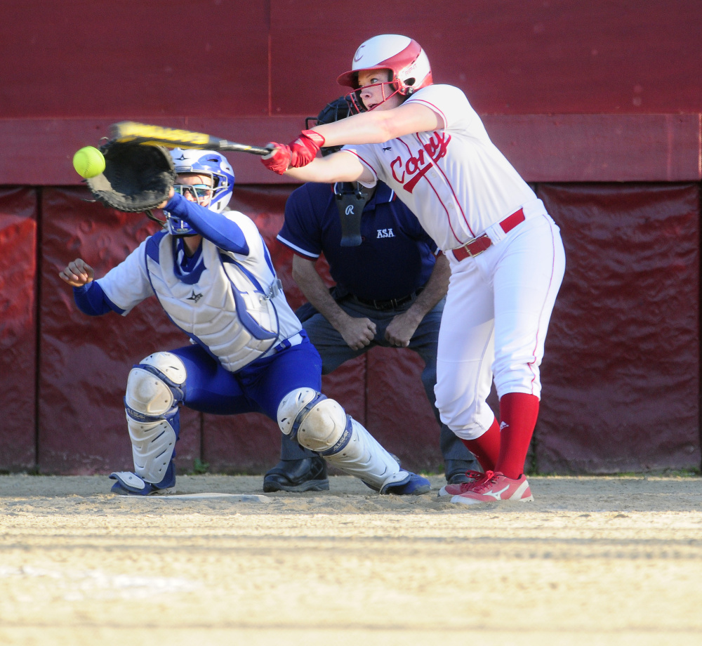 Cony's Kassidy Turgeon swings at a pitch as Madison catcher Aly LeBlanc hauls it in during the Class A/B senior all-star game Thursday night at Cony Family Field.