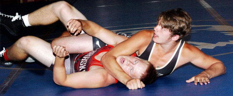 Mountain Valley's Eddie Deroche, right, pins Nebraska's Alex Dubas during a match Monday night in Rumford. The 35th annual Maine-Nebraska wrestling exchange is this week, with matches scheduled in Rumford, Belfast and Skowhegan.