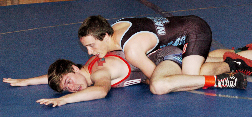 Nebraska's Kobe Paczosa, top, wrestles Griffin Smith during a match Monday night at Mountain Valley High School. The 35th annual Maine-Nebraska wrestling exchange is this week, with matches scheduled in Rumford, Belfast and Skowhegan.