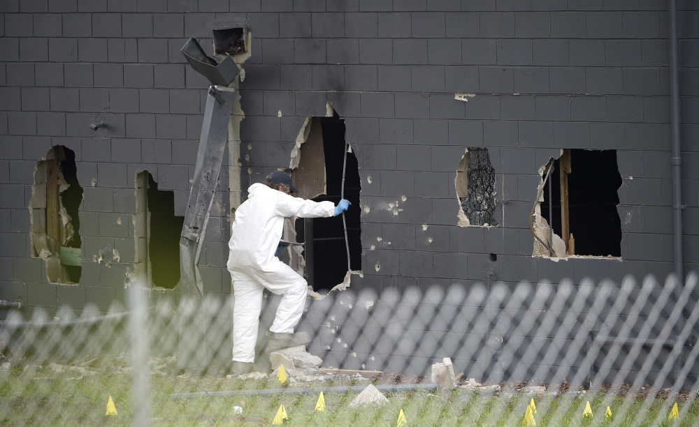 asdf;lkjk .... Law enforcement officials investigate the rear of Pulse Orlando after a shooting involving multiple fatalities at the nightclub in Orlando, Fla., Sunday, June 12, 2016.(AP Photo/Phelan M. Ebenhack)