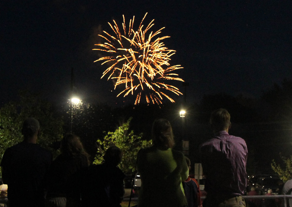 Fourth of July fireworks explode over the Kennebec River earlier this month as seen from the Hathaway Creative Center in Waterville. The town of Winslow said Fort Halifax Park, across the river, where most of the fireworks crowd gathers, is no longer big enough to host the event. Organizers are looking for a new venue after 26 years in Winslow.