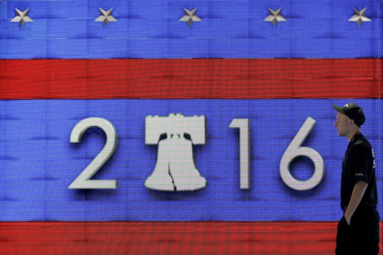 A worker walks past a video display during preparations for the 2016 Democratic National Convention on Friday in Philadelphia. 
Associated Press/Matt Slocum