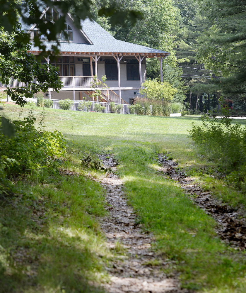 The gravel path that was used to access Mann Cemetery in Freeport was seeded and loamed by L.L. Bean for the Flying Point Paddling Center, effectively closing off access to the cemetery.