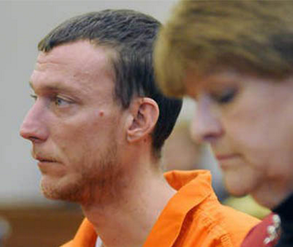 Mark Halle, 33, of Waterville, listens during his bail hearing in February with his attorney, Pamela Ames, in the Capital Judicial Center in Augusta.