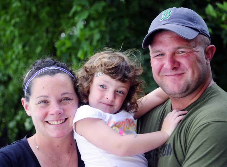 Suzanne Myers, left, and U.S. Army Sgt. Cody Myers with their daughter, Addison Myers, during an interview last week in Augusta.