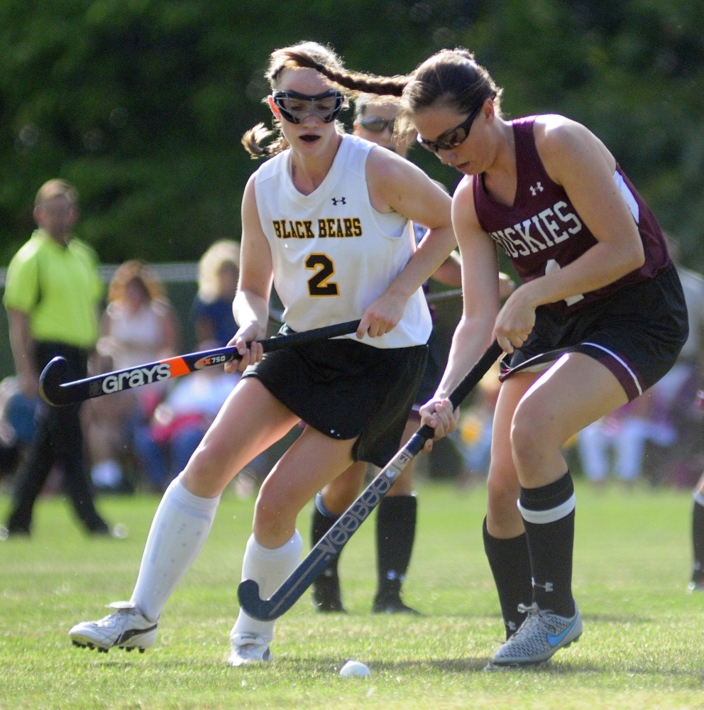 Maranacook junior Erin Bonenfant tries to catch MCI junior Addie Williams during a game Thursday in Readfield.