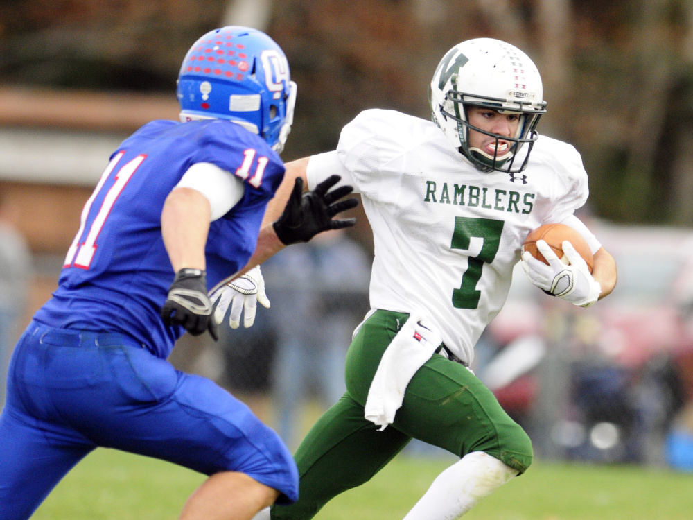 Winthrop/Monmouth running back Nate Scott looks to break away from Oak Hill defensive back Jonah Martin during a Campbell Conference Class D semifinal game last season in Wales. Scott and the Ramblers visit Lisbon on Saturday.