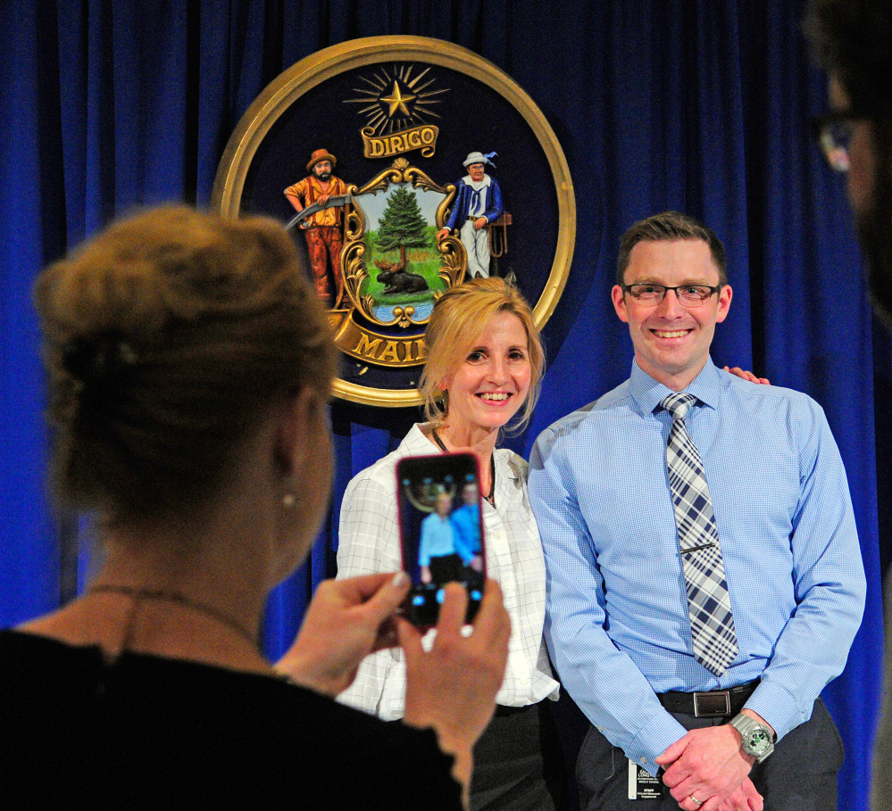 Somerset County Teacher of the Year Tamara Ranger, left, poses with Zach Longyear, her principal at Skowhegan Area Middle School, on May 13 during Teacher of the Year event in the State House Hall of Flags in Augusta. Ranger is now one of the top three candidates for state Teacher of the Year. The recipient of the award will be announced in October.