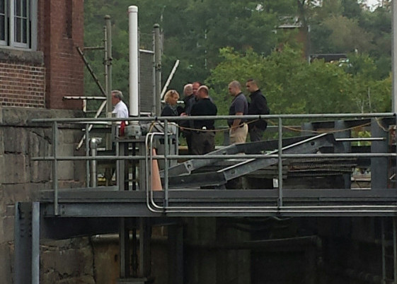 Authorities convene near the Lockwood Dam along the Kennebec River in Waterville Tuesday morning as a body is recovered from the water.