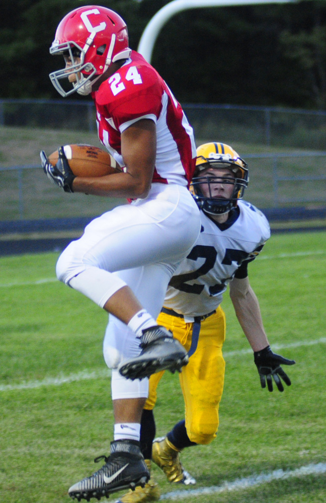 Cony wide receiver Jordan Roddy leaps as he catches a pass on the 5-yard line in front of Mt. Blue defender Sean Testa during a Pine Tree Conference Class B game last Friday night at Alumni Field in Augusta. Roddy had a big game, scoring five touchdowns. Next up for the Rams: A showdown with Messalonskee on Friday in Augusta.