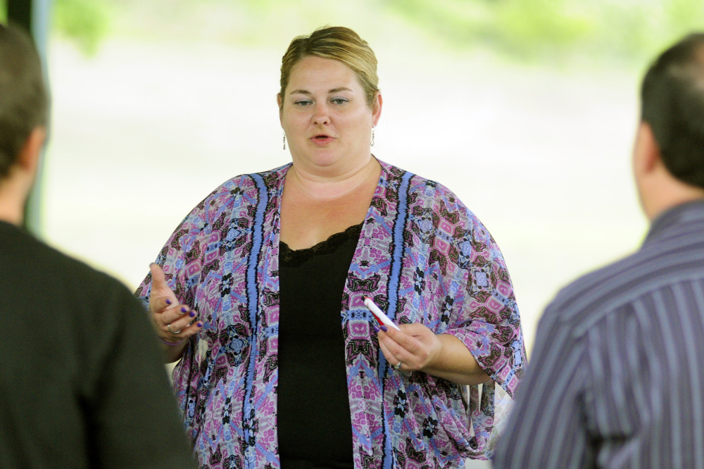 Shannon Hamilton, of Augusta, speaks during The Addict's Mom Light of Hope event Saturday in Mill Park in Augusta.