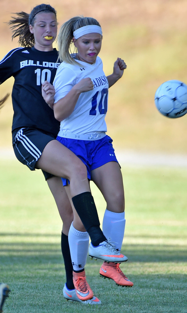 Madison senior Madeline Wood, front, battles for the ball with Hall-Dale sophomore Olivia Bourque during a Mountain Valley Conference game Tuesday afternoon.