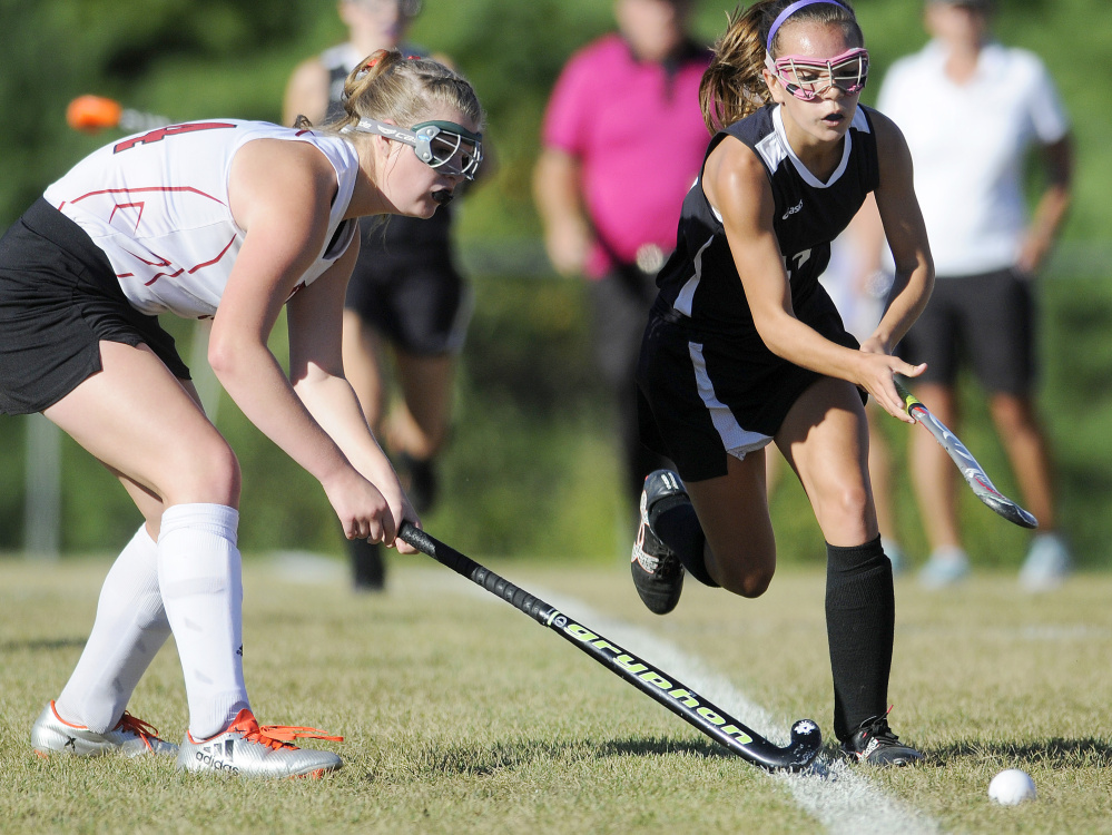 Cony senior Julia Sternad, left, defends Skowhegan freshman Alexis Michonski during a Kennebec Valley Athletic Conference Class A game Tuesday in Augusta.