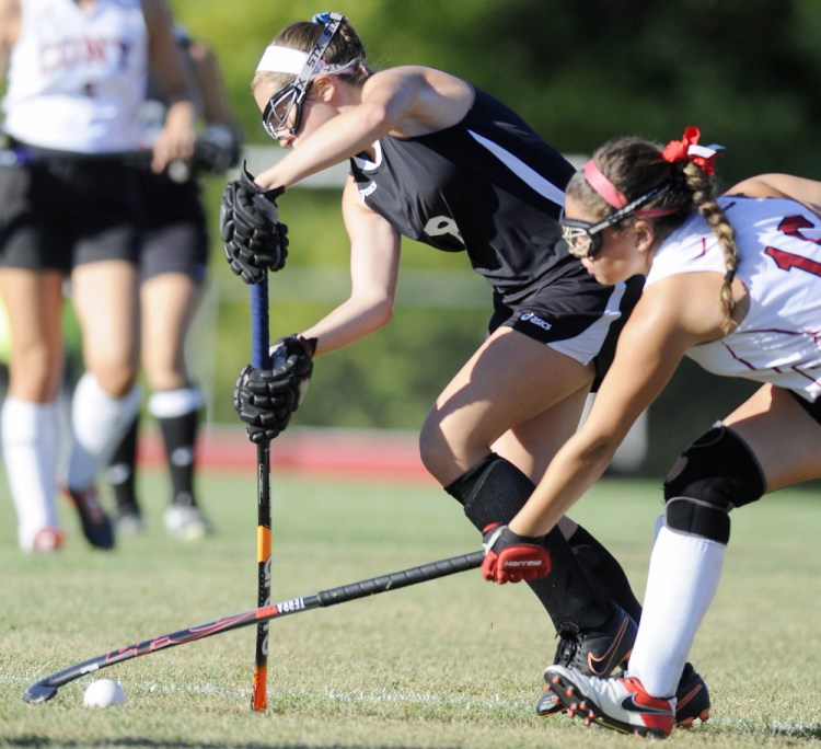 Cony junior Danielle Brox, right, blocks a pass by Skowhegan junior Haley Carter during a Kennebec Valley Athletic Conference Class A game Tuesday in Augusta.