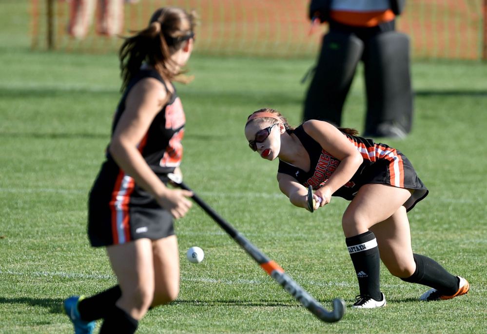 Gardiner's Kalee Michaud passes the ball forward to teammate Jillian Bisson, left, in the first half against Maine Central Institute on Tuesday in Pittsfield.