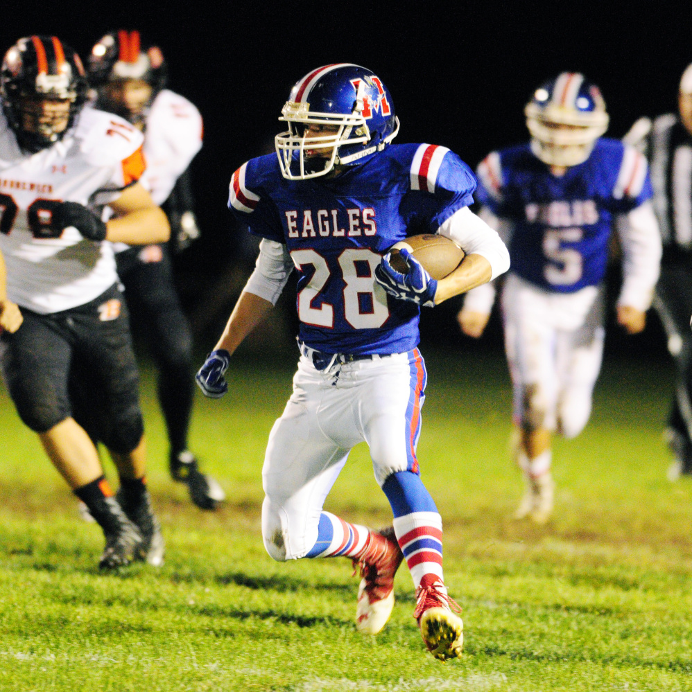 Messalonskee's Tyler Lewis runs the ball during a Pine Tree Conference Class B game against Brunswick on Friday at Veterans Field in Oakland.