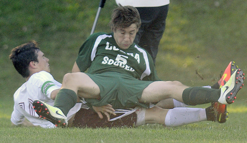 Monmouth's Mat Foulke and Carrabec's Cade Chipman fall after colliding   Thursday in Monmouth.