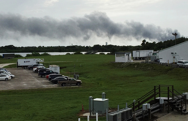 Smoke rises from a SpaceX launch site Thursday, Sept. 1, 2016, at Cape Canaveral, Fla. NASA said SpaceX was conducting a test firing of its unmanned rocket when a blast occurred. (AP Photo/Marcia Dunn)