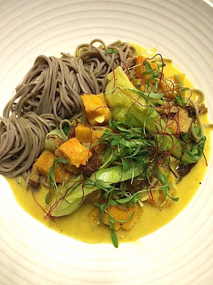 The squash and house yellow curry is the first vegan dinner entree on the menu at Union in the Press Hotel in Portland.