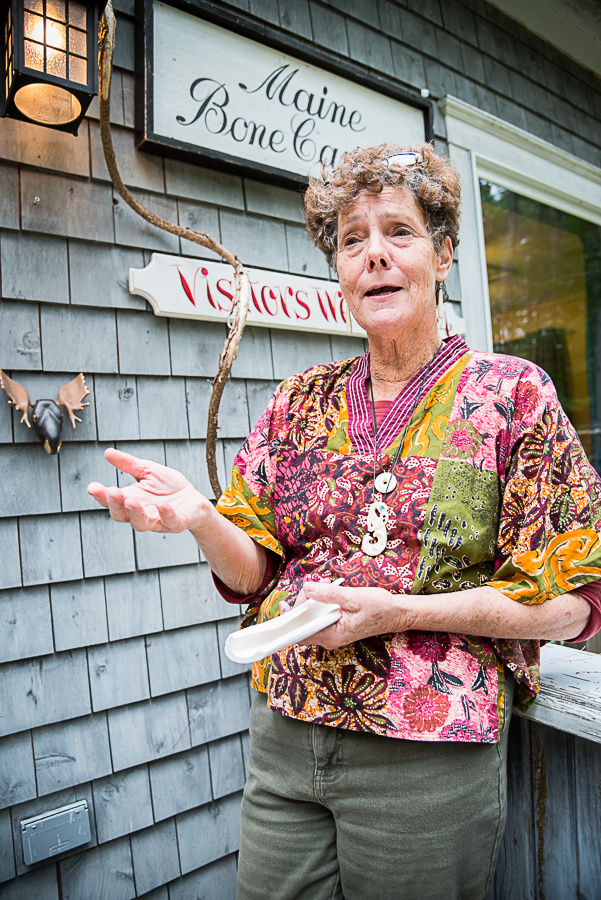 Bone carver Valerie Hoff, of Mount Vernon, holds a piece of bone from a moose's leg. Valerie and her husband, Gerald, acquire the bone from butchers who process moose delivered by local hunters.