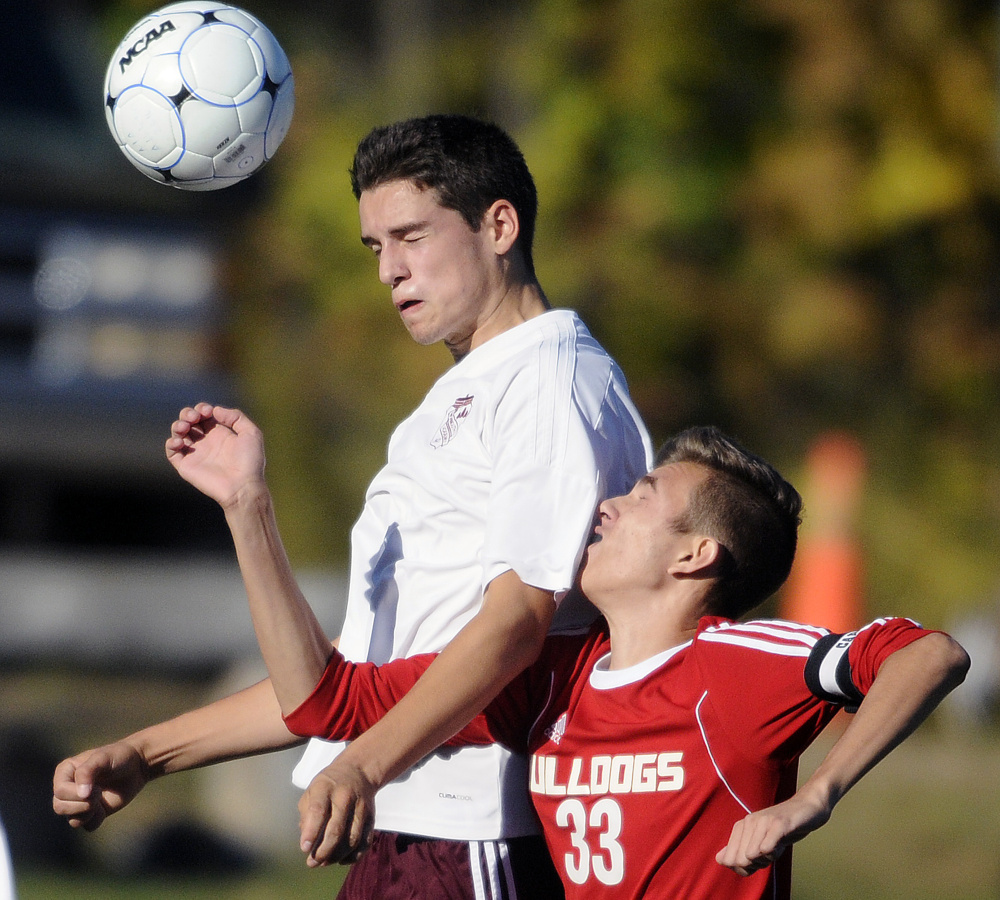 Monmouth's Travis Hartford, left, and Hall-Dale's Cody Guyon go up for a header during a soccer game Tuesday in Monmouth.