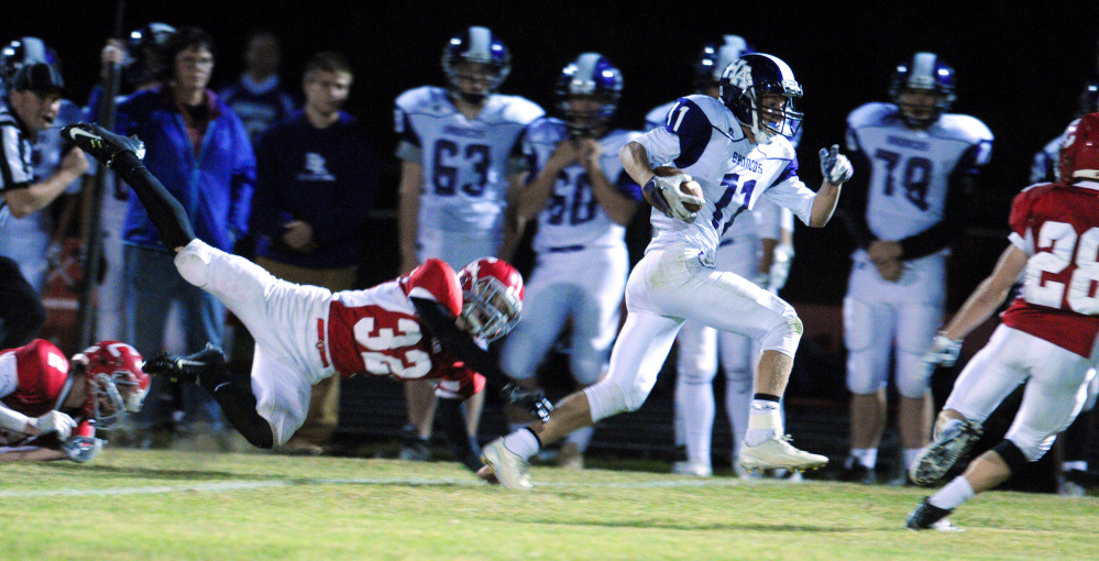 Cony's Michael Wozniak, left, dives after Hampden's Tyler Knights during a Pine Tree Conference B game Friday in Augusta.