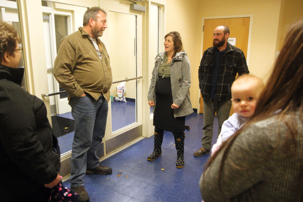 For the first time since her Oct. 10 car accident, Erin Kaye of Durham greets the man she believes saved her life. Truck driver Scott Landon, of Burnham, came to Kaye's aid after she lost control of her car while traveling south to work on Interstate 295 in Falmouth. Standing with Kaye is her husband, Clint.